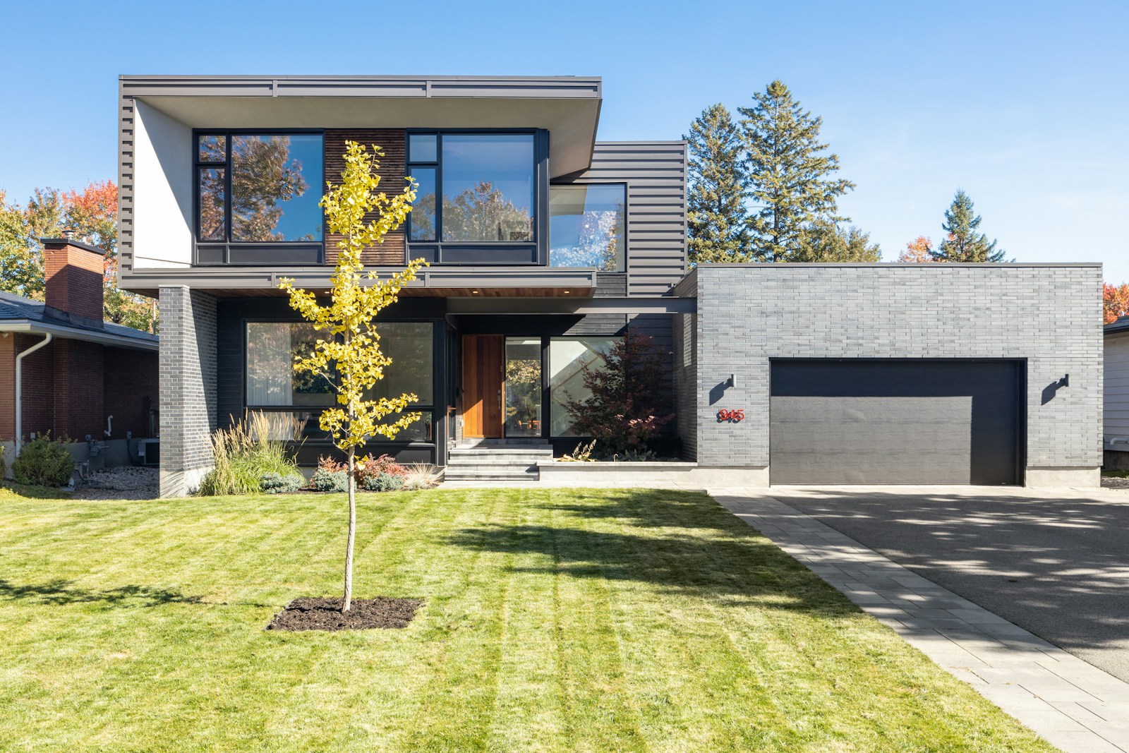 a house with a tree in the front yard